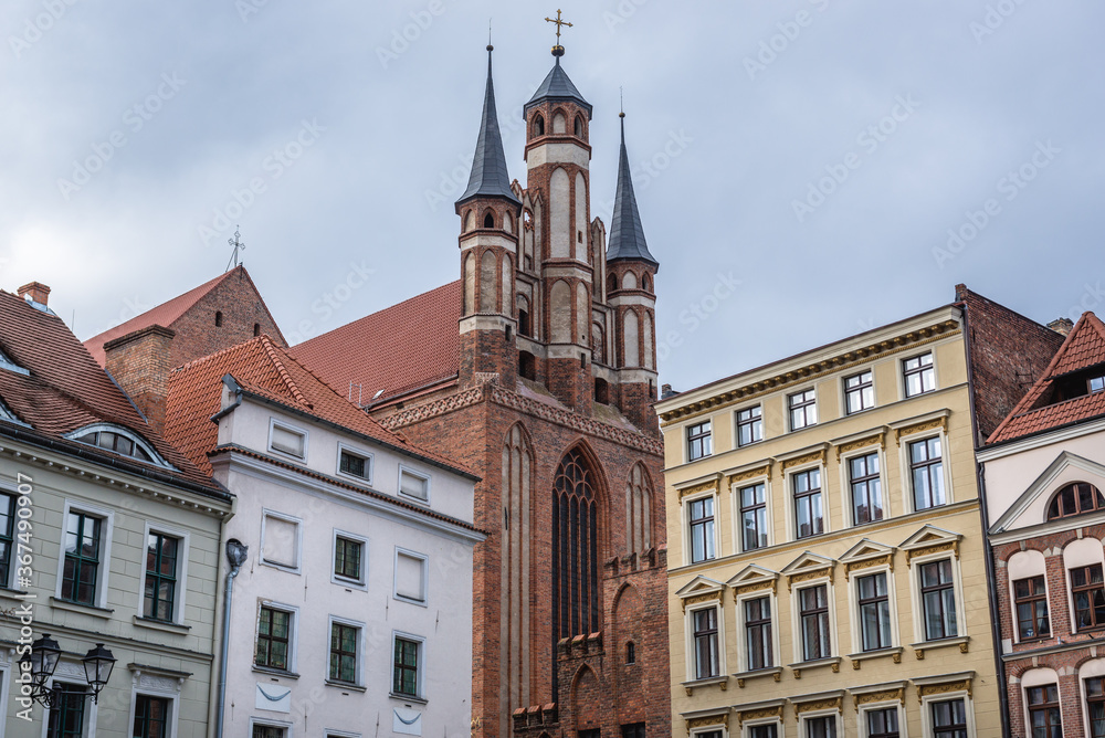 Holy Spirit Church and buildings on the main square of historic part of Torun city in north central Poland