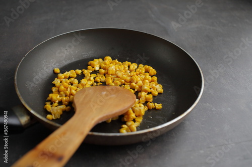 Diet. Organic Grilled Corn in a frying pan. Organic farm vegetables. Vegetarian