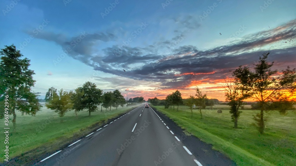 Road in Poland. Sunset. Goldenhour. Beautiful sky.  Landscape in Poland. Lubusz district
