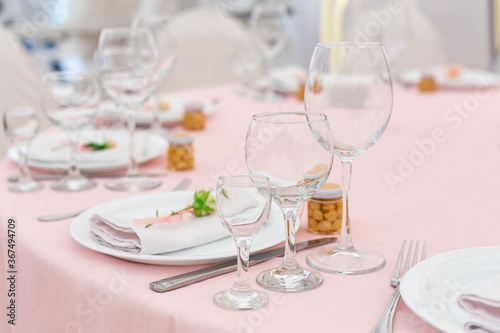 Beautiful decoration set for wedding party. Design by flower, variety luxury glass and candle. Selective focus © simikov