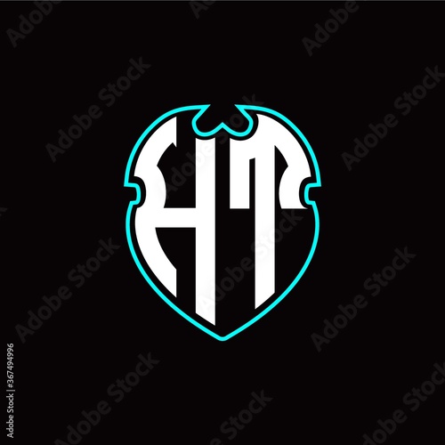 Fototapeta Naklejka Na Ścianę i Meble -  H T Initial logo design with a shield shape