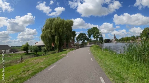 Nieuwekerk aan de Amstel, a place in Holland with a beautiful church at the river side photo