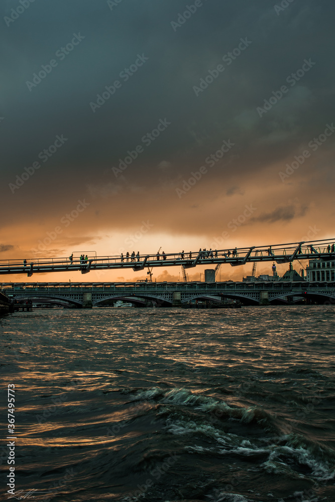 Millennium bridge just before sunset in London.