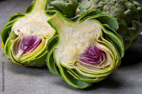 Big ripe uncooked green globe artichoks vegetables photo