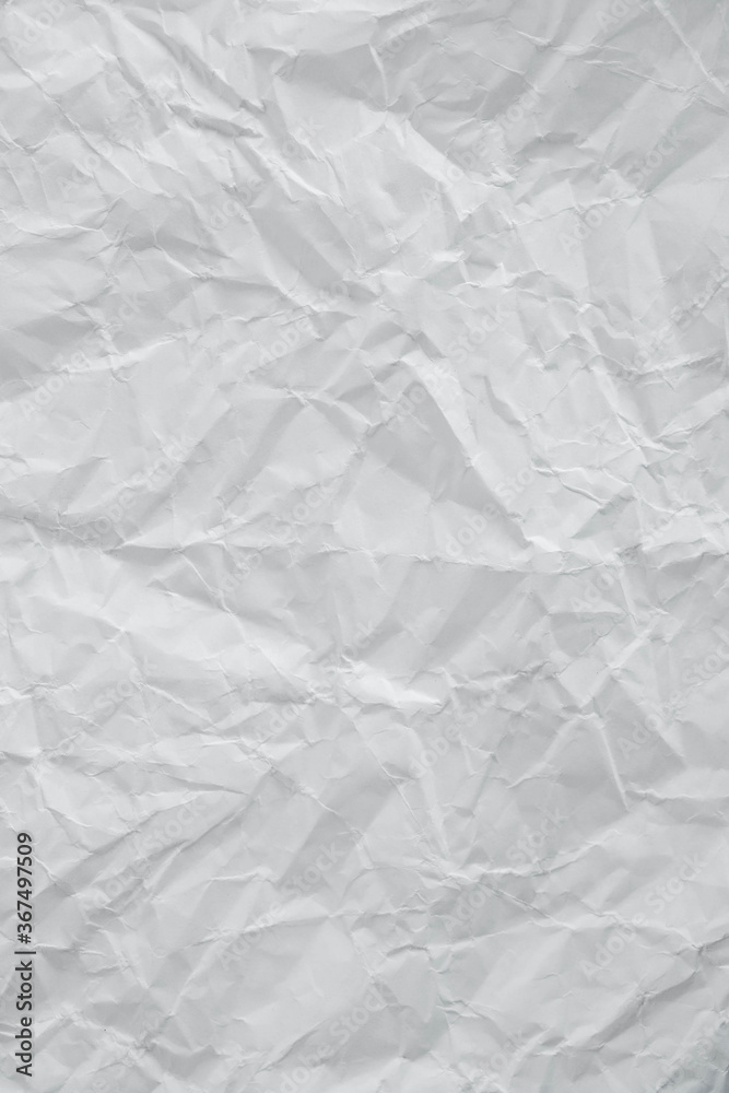 Crumpled white paper texture as a background image. Paper for design with copy space for text or image. Top view. Copy, empty space for text