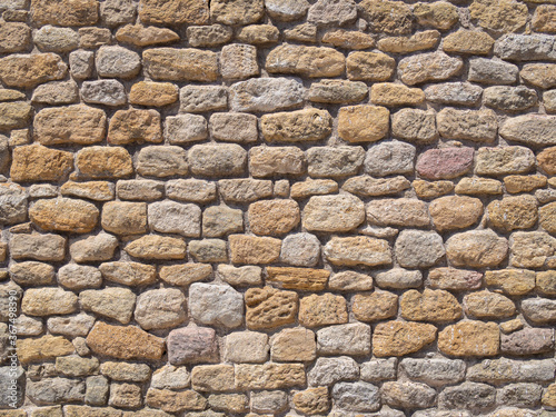 Real antique spanish rubble wall background texture