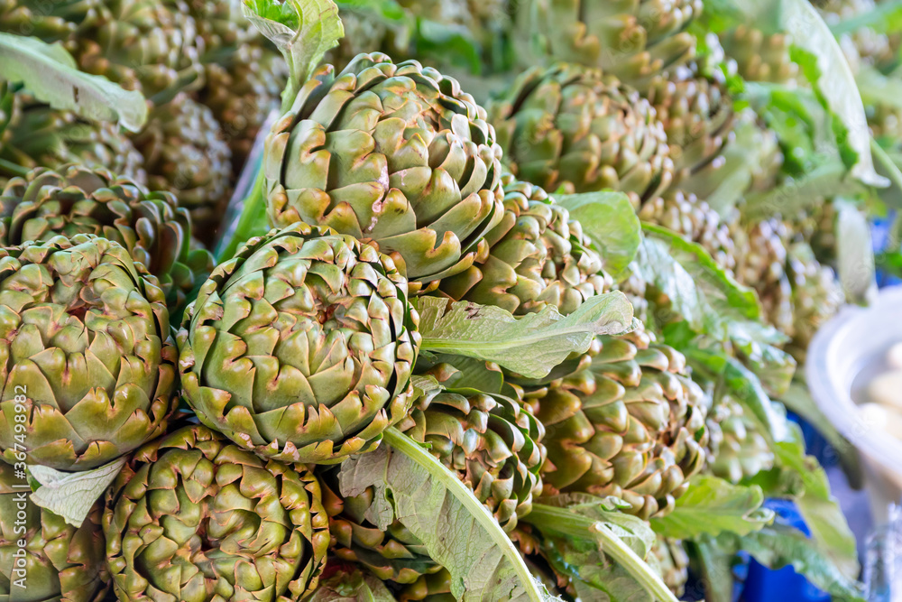 Fresh and organic artichokes on market stall. Fresh and organic artichokes on market stall.