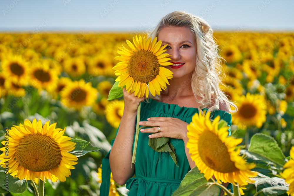 Young attractive woman in a sunflower field Young attractive woman in a sunflower field
