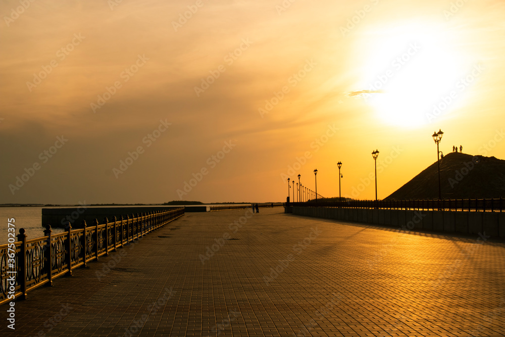 Deserted promenade during sunset