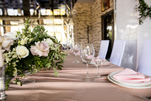 Side view of close up of presidium with fresh flowers of the newlyweds at the wedding