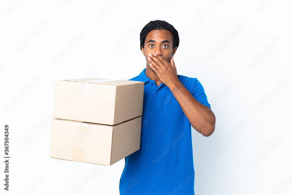 Delivery African American man with braids isolated on white background happy and smiling covering mouth with hand Delivery African American man with braids isolated on white background happy and smiling covering mouth with hand