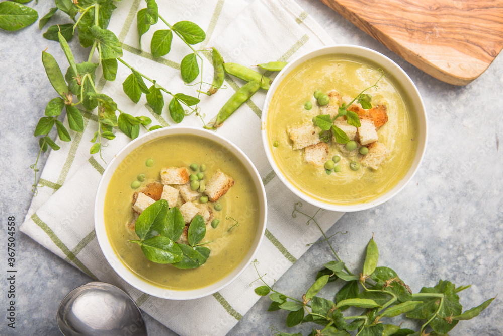 Plate of summer delicious pea soup with green peas. Top view Plate of summer delicious pea soup with green peas. Top view