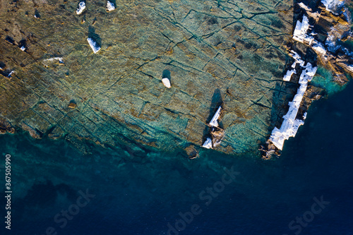 Aegean seashore and marble rocks in Aliki, Thassos island, Greece photo