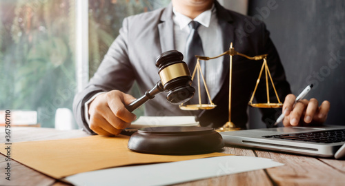 Wallpaper Mural justice and law concept.Male judge in a courtroom on wooden table and Counselor or Male lawyer working in office. Legal law, advice and justice concept. Torontodigital.ca
