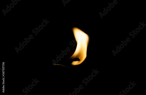 burning diya on black background