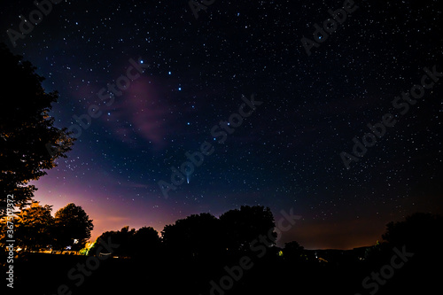 beautiful starry night with the neowise comet in the bavarian forest and the big dipper