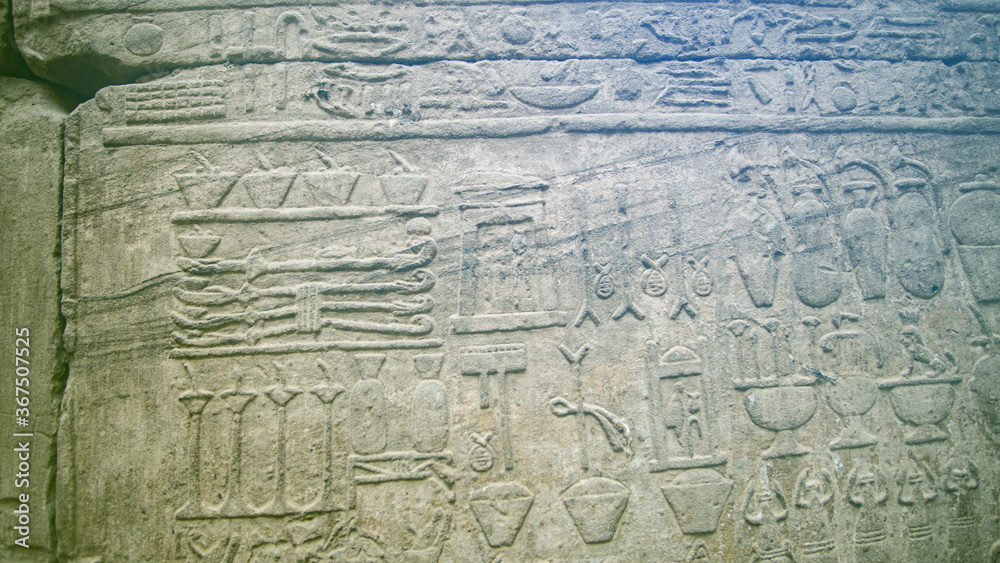 Obraz premium Hieroglyphic in Edfu HOrus temple showing abundance of food resources corn grape culture of Egypt meal kitchen pots and jars