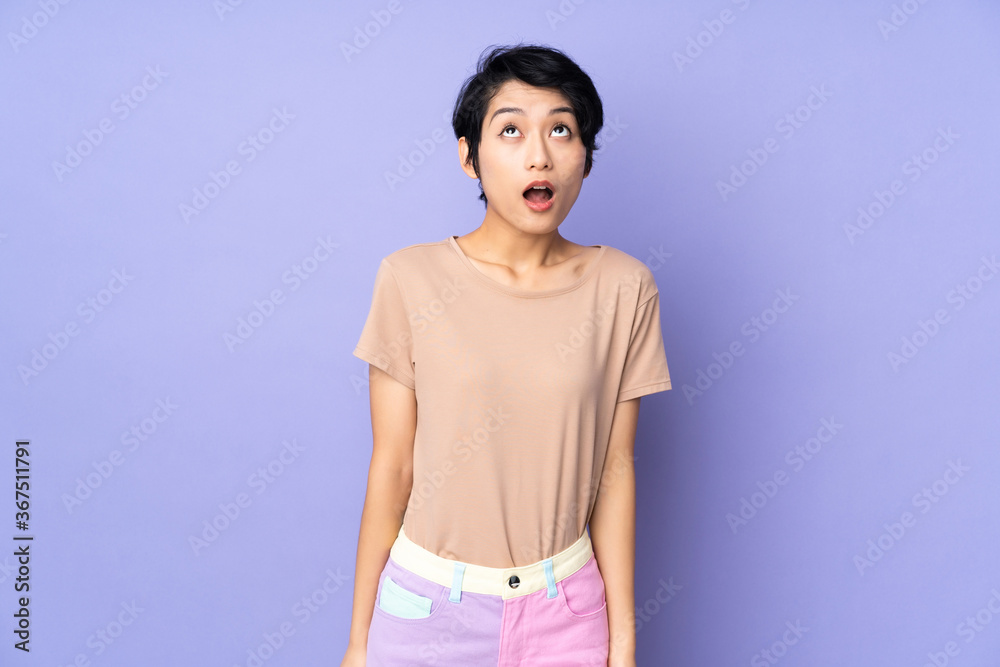 Young asian woman isolated on blue background
Young asian woman isolated on blue background
