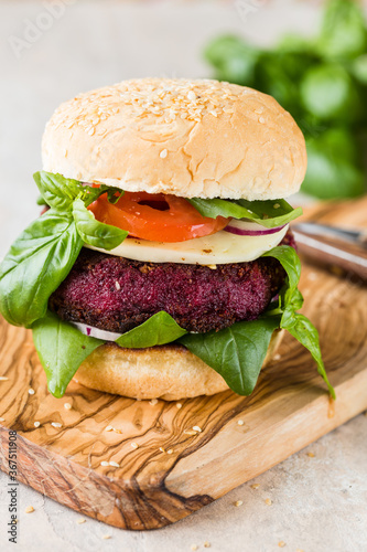 Veggie beet burgers with vegetables and greek sauce. Healthy food concept.