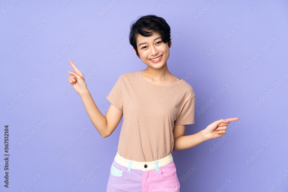 Young asian woman isolated on blue background
Young asian woman isolated on blue background