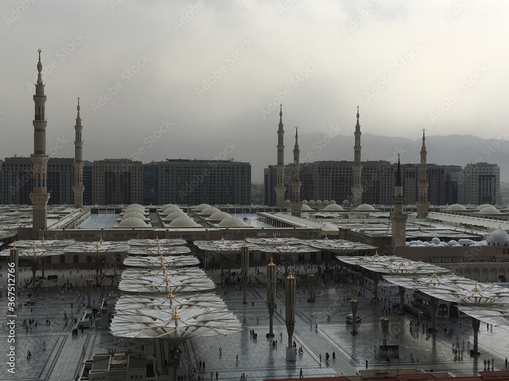 MADINAH, SAUDI ARABIA – August 2019: Muslim pilgrims visiting the beautiful Nabawi Mosque, the Prophet mosque which has great architecture during hajj  season