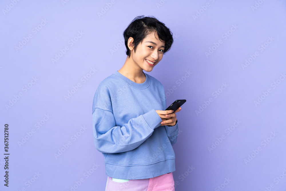 Young asian woman isolated on blue background
Young asian woman isolated on blue background