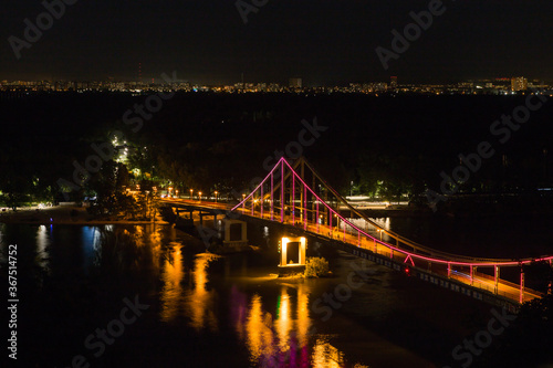 Night panorama of pedestrian bridge on Dnipro in Kiev Ukraine © Maria