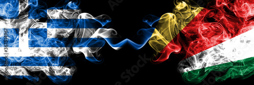 Greece vs Seychelles, Seychelloise smoky mystic flags placed side by side. Thick colored silky abstract smoke flags.