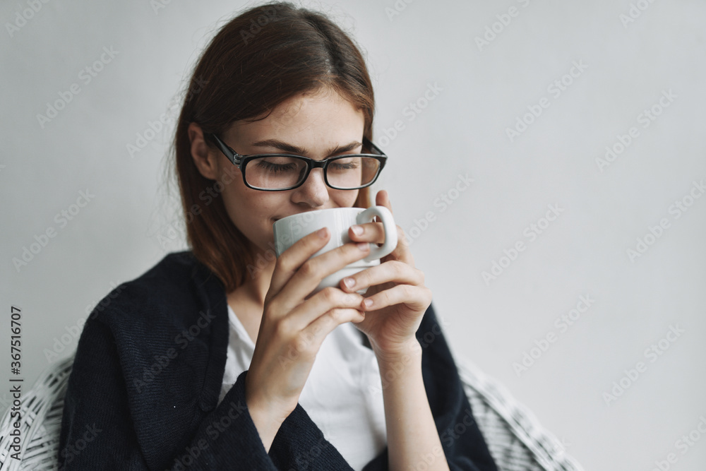 Woman drinking coffee at home armchair interior enjoying Woman drinking coffee at home armchair interior enjoying