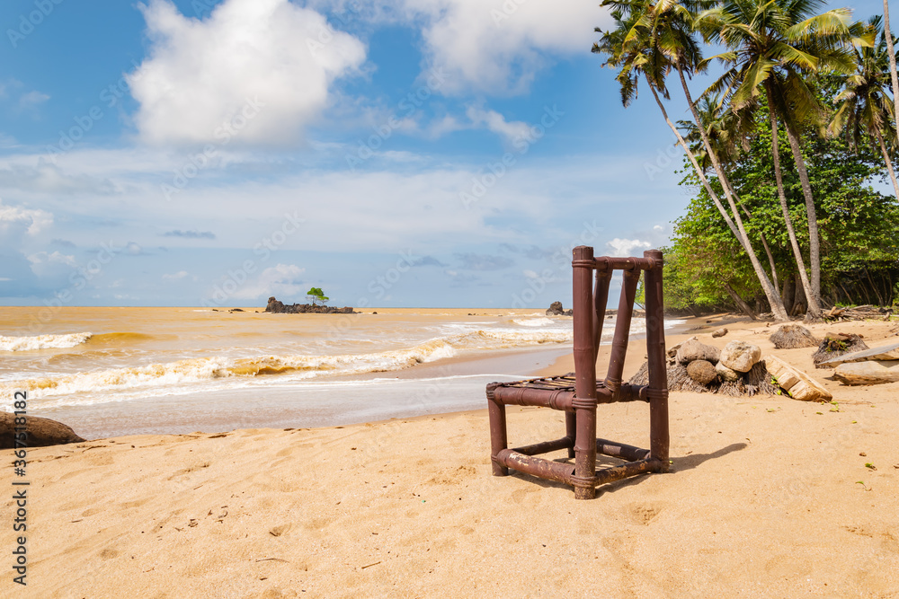 A bamboo chair standing alone on a beach in Axim Ghana West Africa A bamboo chair standing alone on a beach in Axim Ghana West Africa