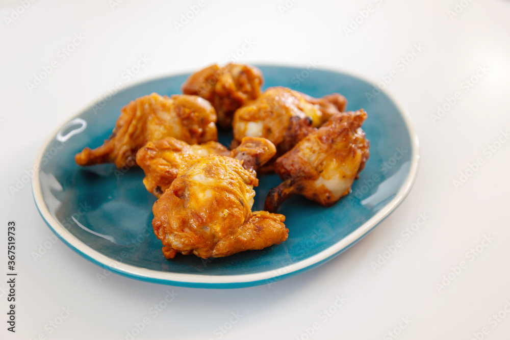 Chicken Wings Spicy chicken wings, breaded, fried, cooked. Chicken Wings Spicy chicken wings, breaded, fried, cooked.
