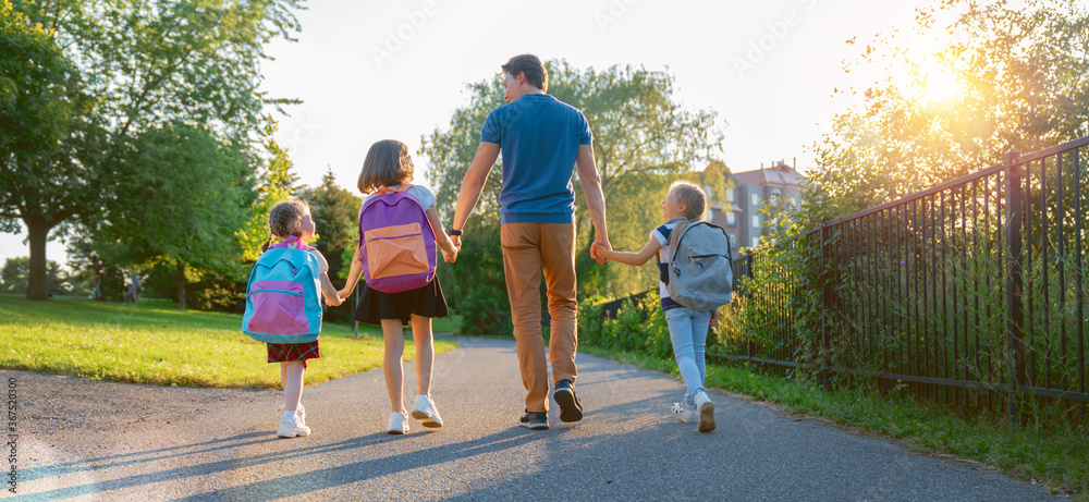 Parent and pupils are going to school - obrazy, fototapety, plakaty 