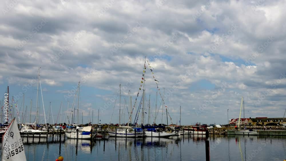 Cloud cover over a marina with yachts moored in southern Sweden Cloud cover over a marina with yachts moored in southern Sweden