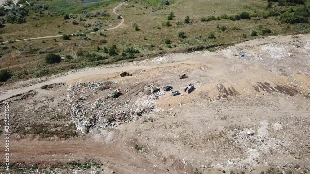 Garbage Truck In A Landfill. Huge City Dump, Top View. Garbage Truck In A Landfill. Huge City Dump, Top View.