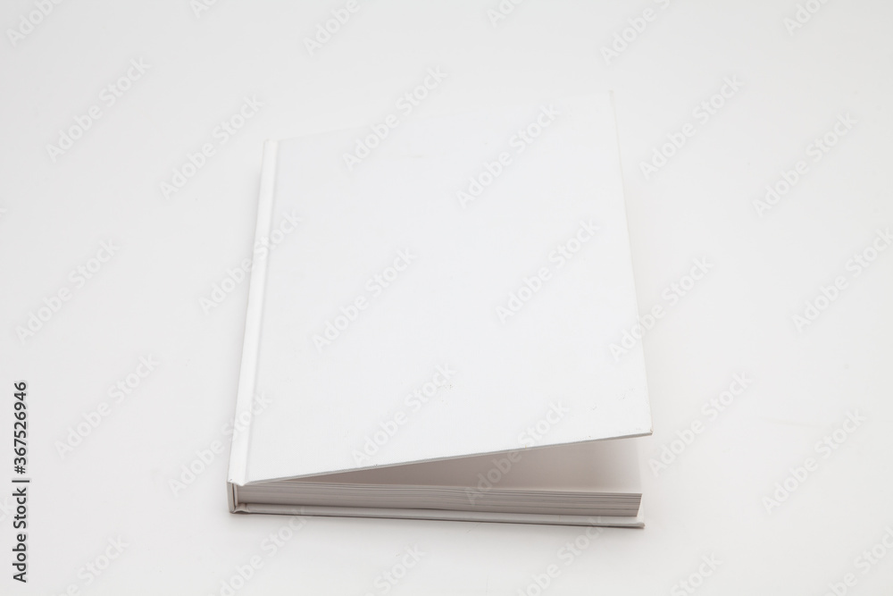 Light open whtite blank book on white background 