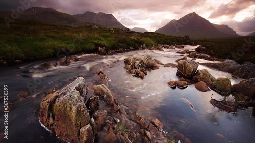 time lapse footage of the river coupall as it flows towards the valley of glencoe in the argyll region of the highlands of scotland in summer photo