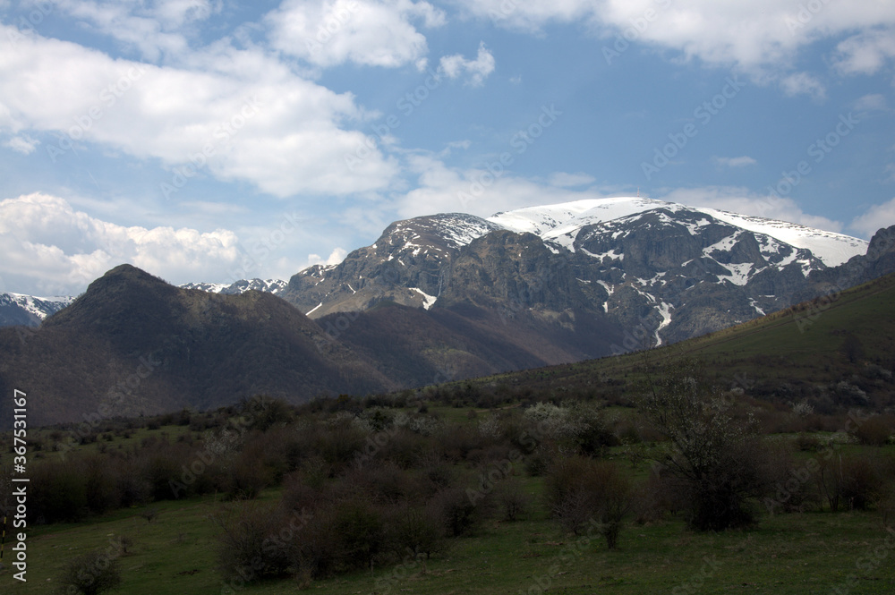 Rocks near Peak Botev, the highest peak of the Balkan Mountains and morning fog