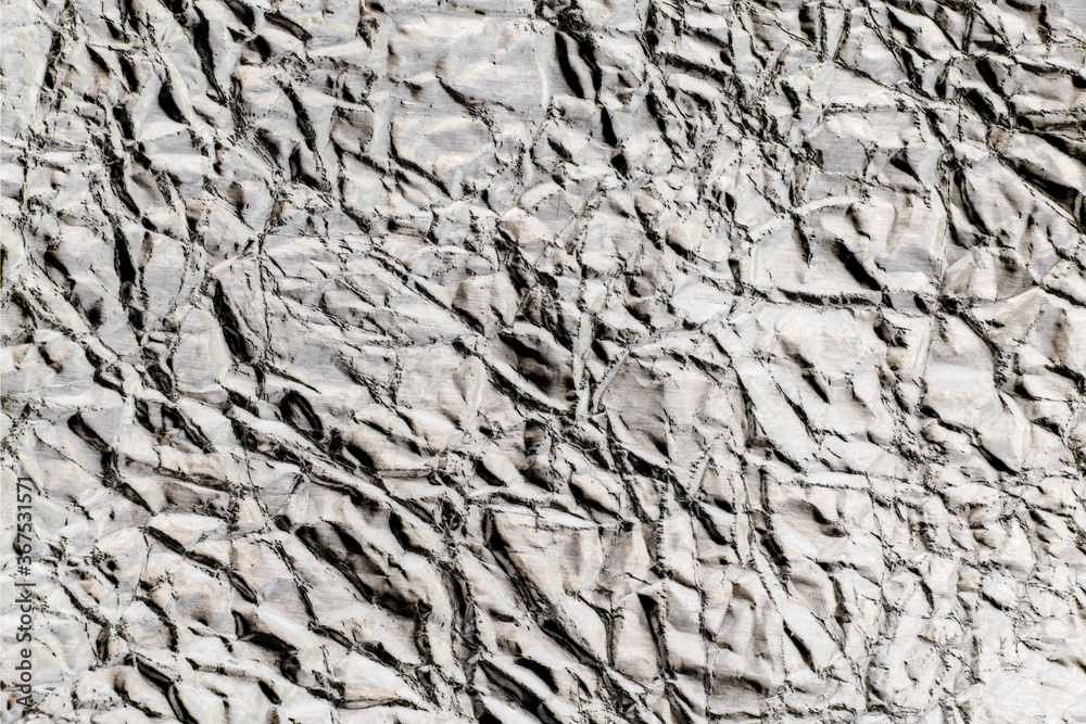 Crumpled wrinkled silver foil texture