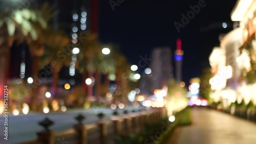 Defocused fabulous Las Vegas Strip boulevard, luxury casino and hotel, gambling area in Nevada, USA. Nightlife and traffic near Fremont street in tourist money playing resort. Neon lights of sin city.