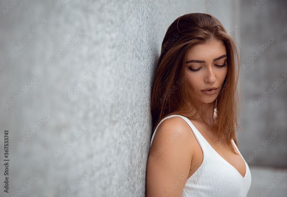 Beautiful girl looking down in Denmark (fashionable young adult - female model) Beautiful girl looking down in Denmark (fashionable young adult - female model)