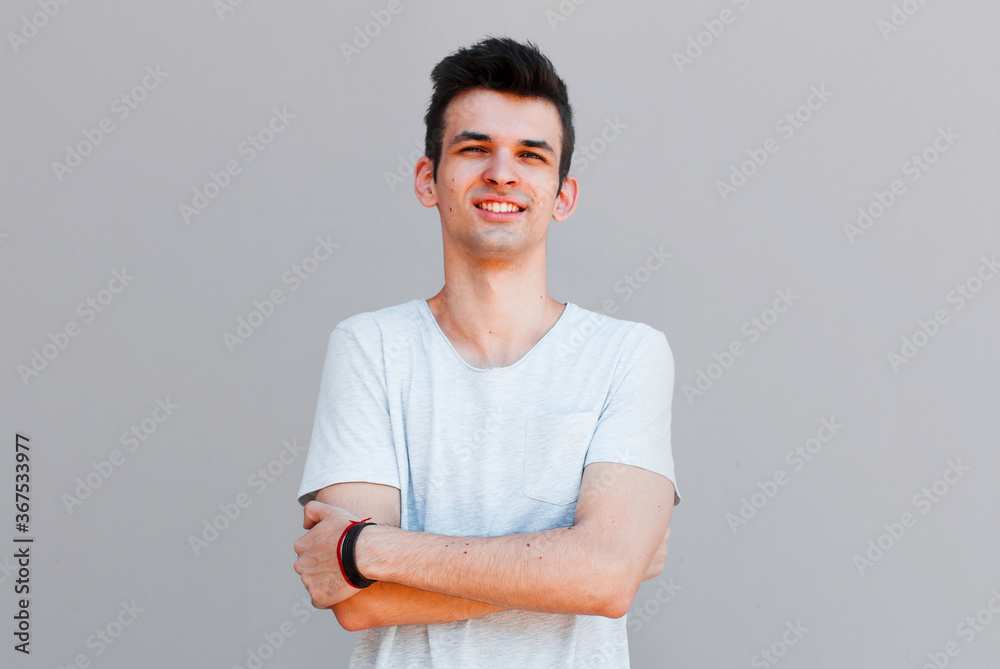 Obraz premium Good looking man, portrait on grey background