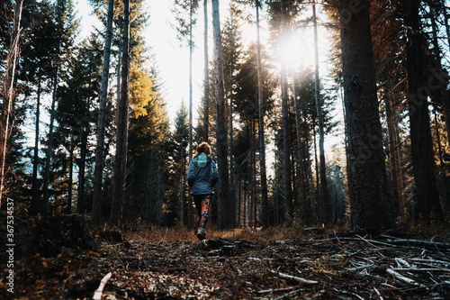 Girl Walking in a forest photo