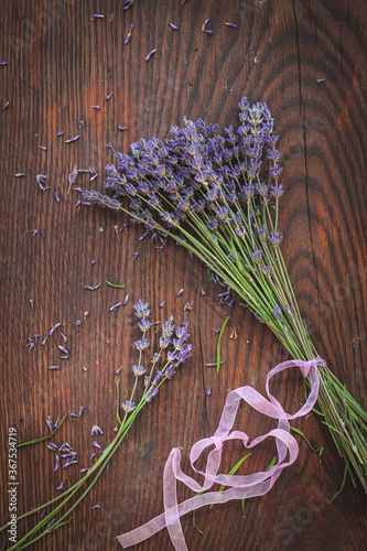 Dried lavender on a dark wooden table  shot from above