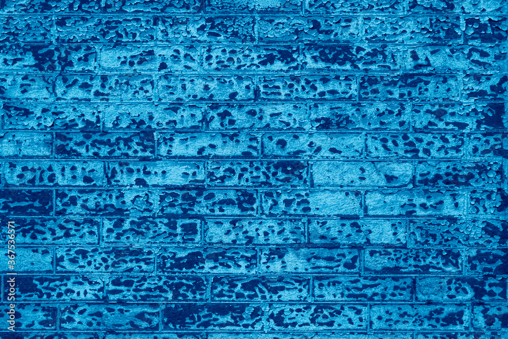 Old brick wall building exterior background texture with blue color effect Old brick wall building exterior background texture with blue color effect