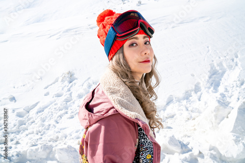 Beautiful asian woman enjoying and relaxing view with snow flake on snow mountain during winter in New Zealand.