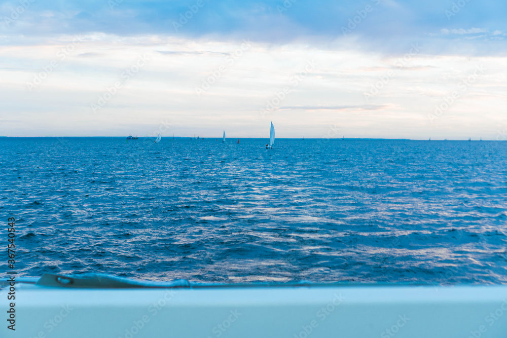 Fototapeta premium sailboats at sunset at sea