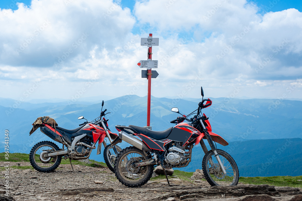 Fototapeta premium two motorcycles on the top of Mount Petros