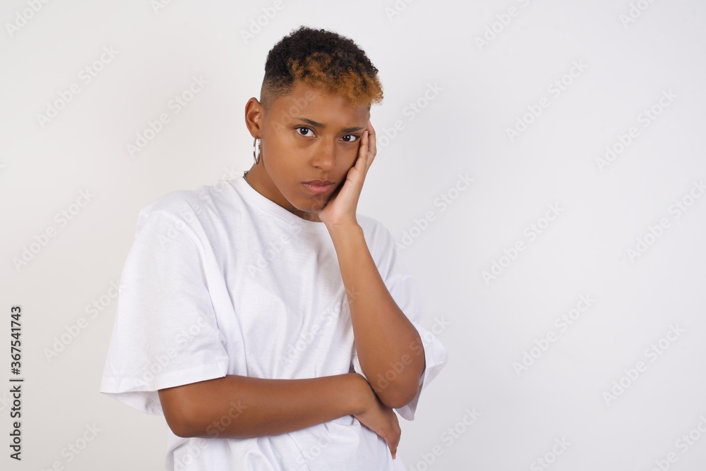 Gloomy young sad asian blond girl sighing upset stoop look from under forehead lonely unhappy lean palm bored feel regret sadness moody expression standing white background pessimistic Gloomy young sad asian blond girl sighing upset stoop look from under forehead lonely unhappy lean palm bored feel regret sadness moody expression standing white background pessimistic