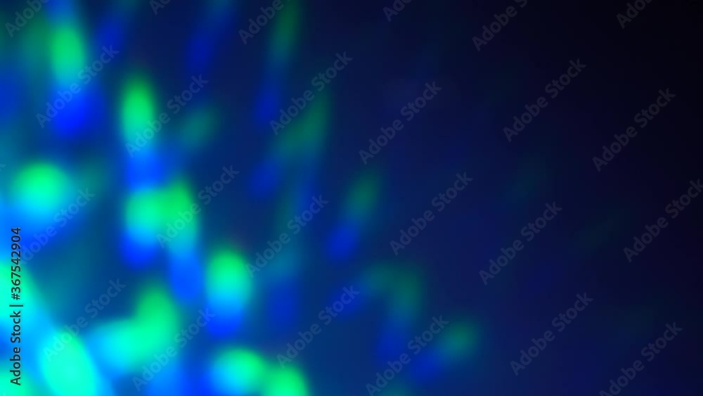 Blue and green neon holographic gradient on a dark background. Laser prismatic lights and reflections. Abstract dynamic movement Blue and green neon holographic gradient on a dark background. Laser prismatic lights and reflections. Abstract dynamic movement