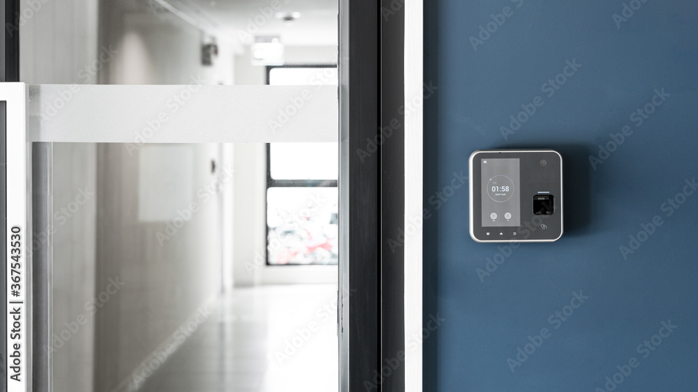 Finger or card scanner device placed on blue wall to unlock the entrance door. Smart home technology Concept Finger or card scanner device placed on blue wall to unlock the entrance door. Smart home technology Concept
